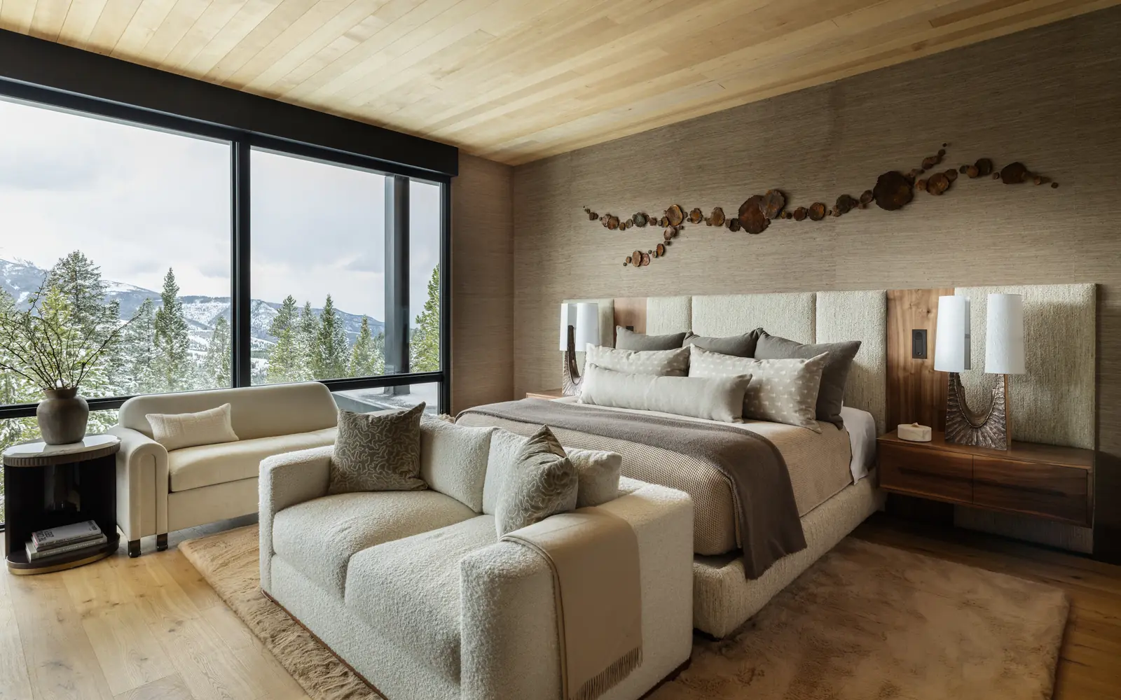 Primary suite with a grasscloth wall and mountain views