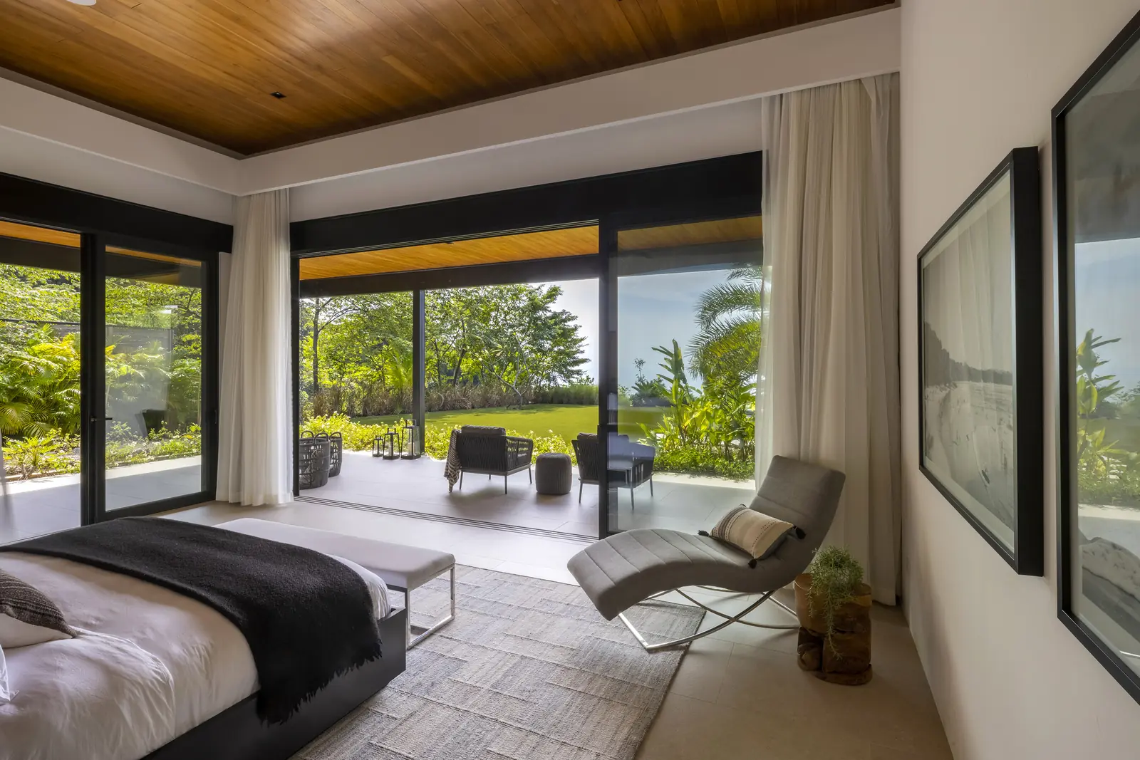 Bedroom opening onto a tropical garden terrace